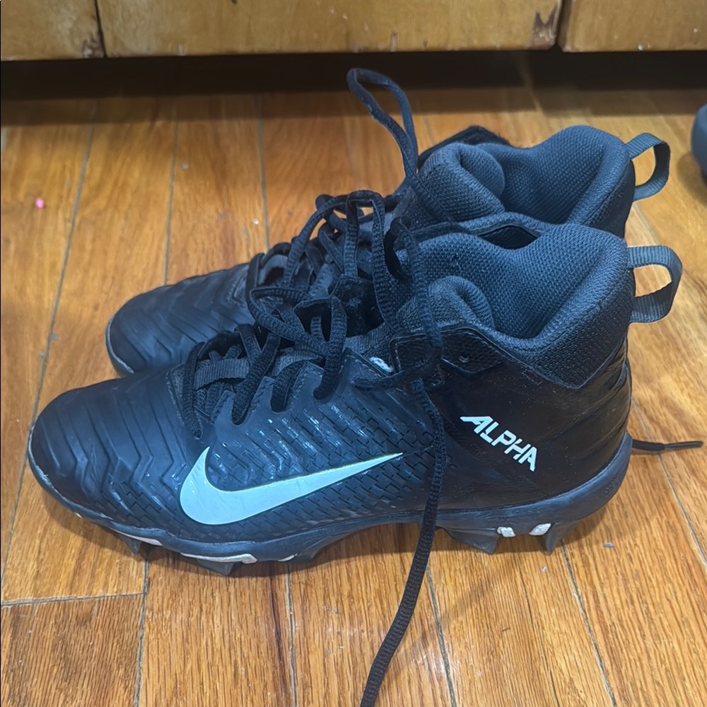 Nike Black Kids' Alpha Cleats with White Swoosh